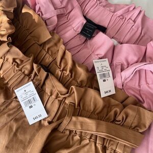 2 Ashley Stewart "Linen Blend Paper Bag Pants."